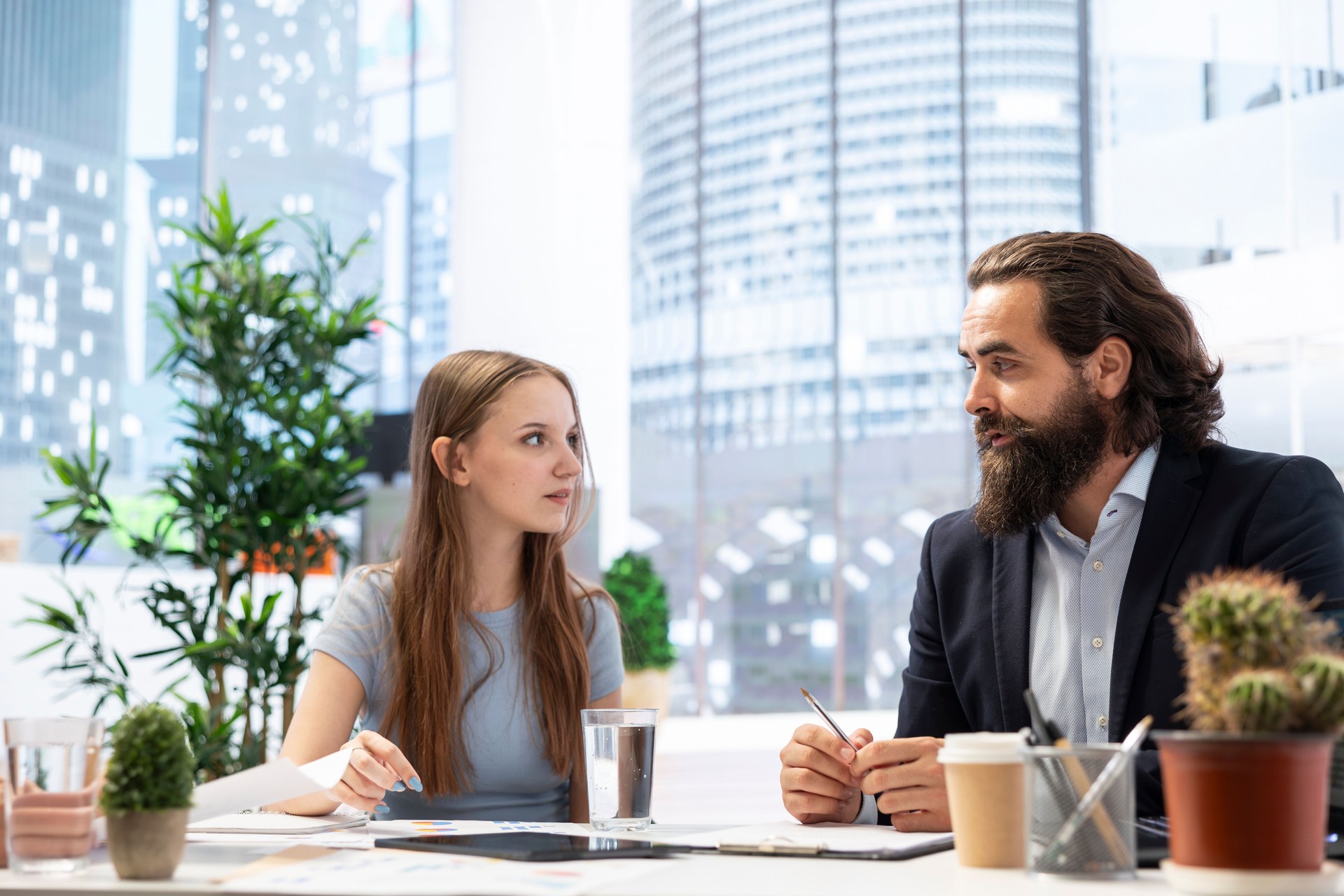 Young adult taking advice from financial advisor about student loans